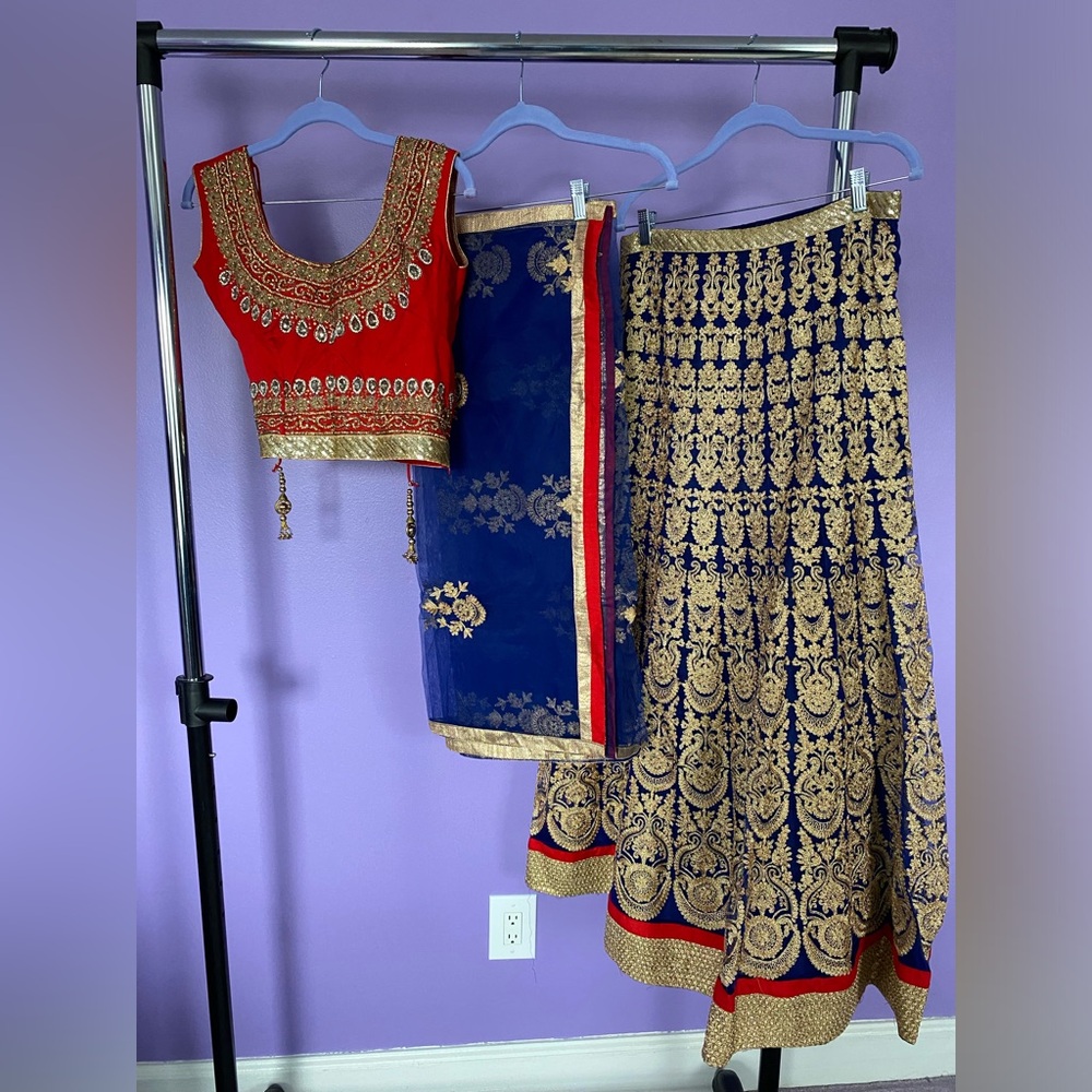 Indian lehenga with bottom, top and chunni. Blue and red with gold.